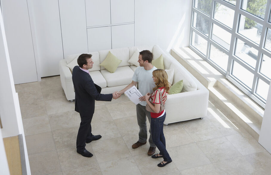 Three people viewing a house