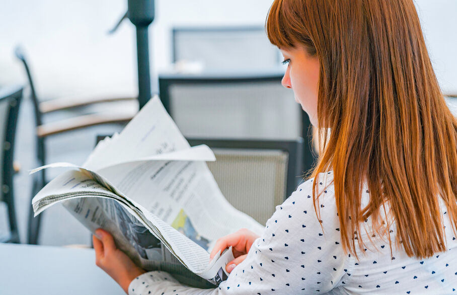 Someone reading a newspaper