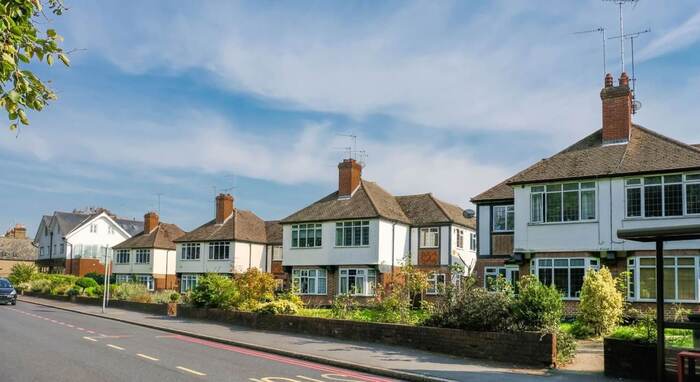 A picturesque row of houses under a blue sky in Mitcham